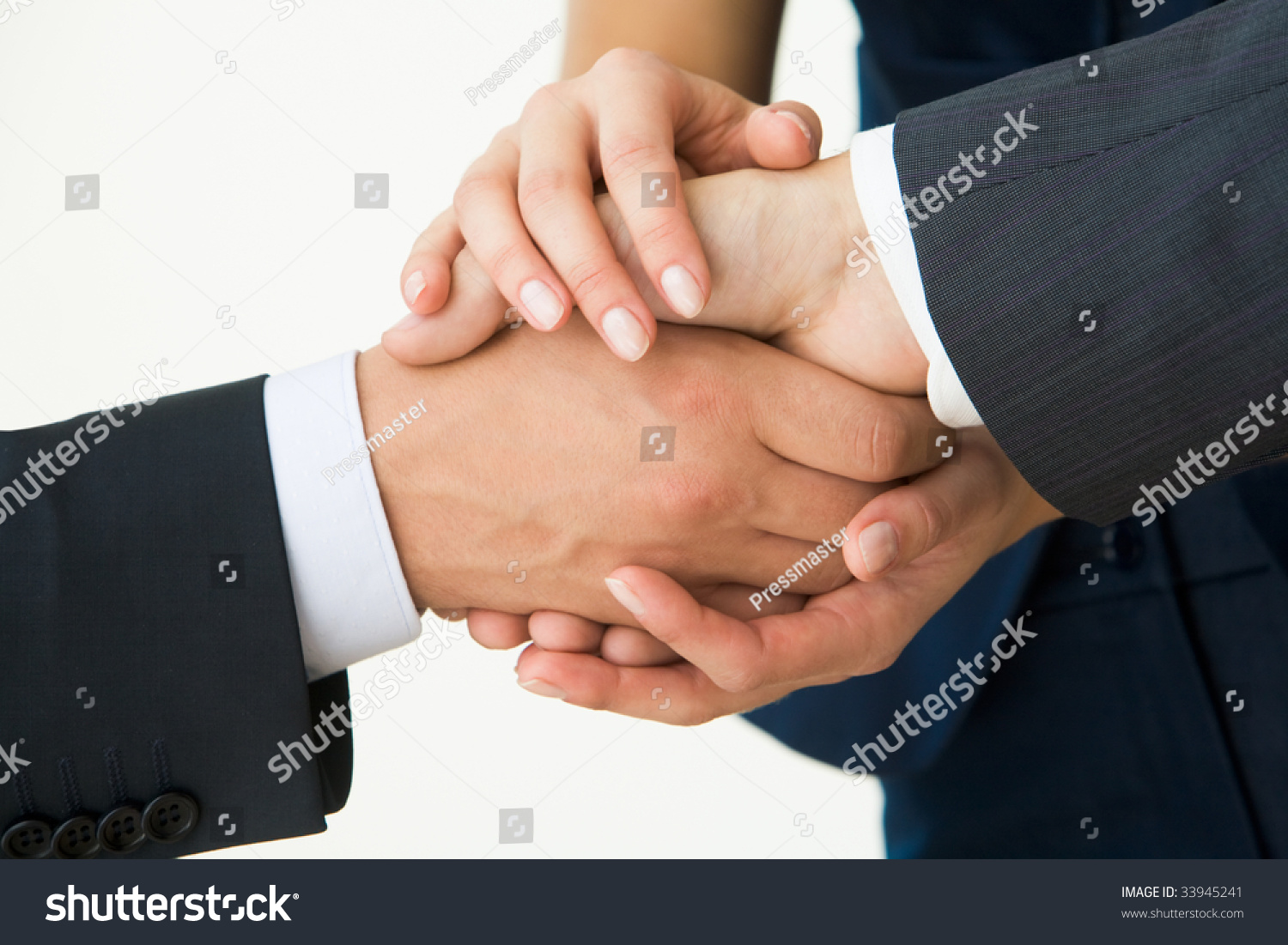 握手的照片,白色背景惊人的交易后的业务合作伙伴